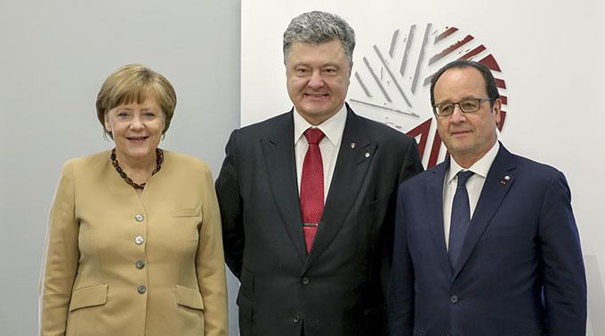 Angela Merkel, Petro Poroschenko, Francois Hollande. (Archivbild)